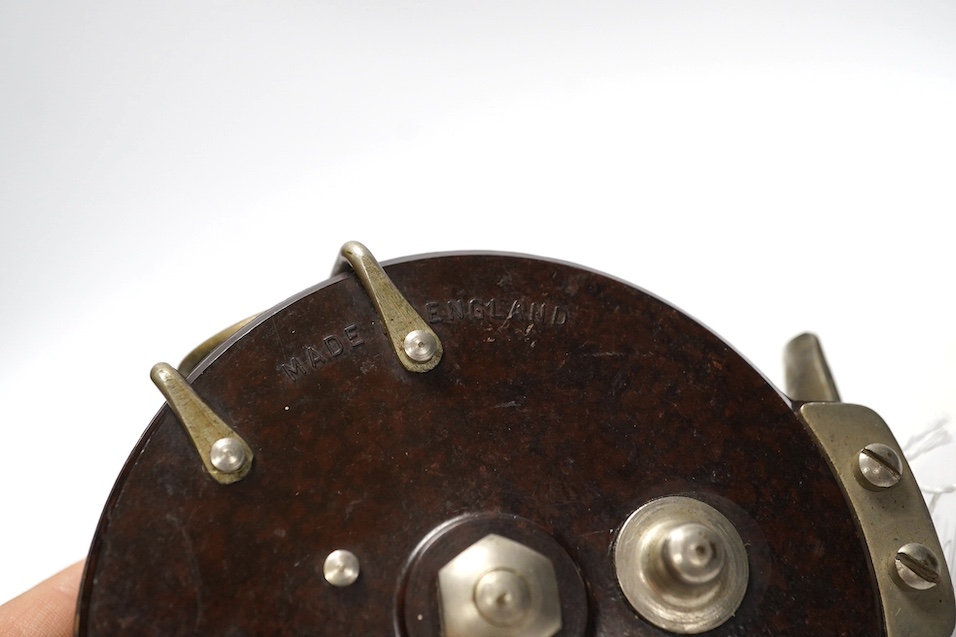 Four fishing reels, including a Bakelite Alcock Aerialite, an Elo, a Seprage C.A.P and a wooden reel, largest 10.5cm diameter. Condition - used, fair